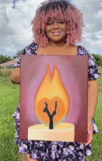 Morgan Cerese holding Burning Apart twin flame acrylic painting